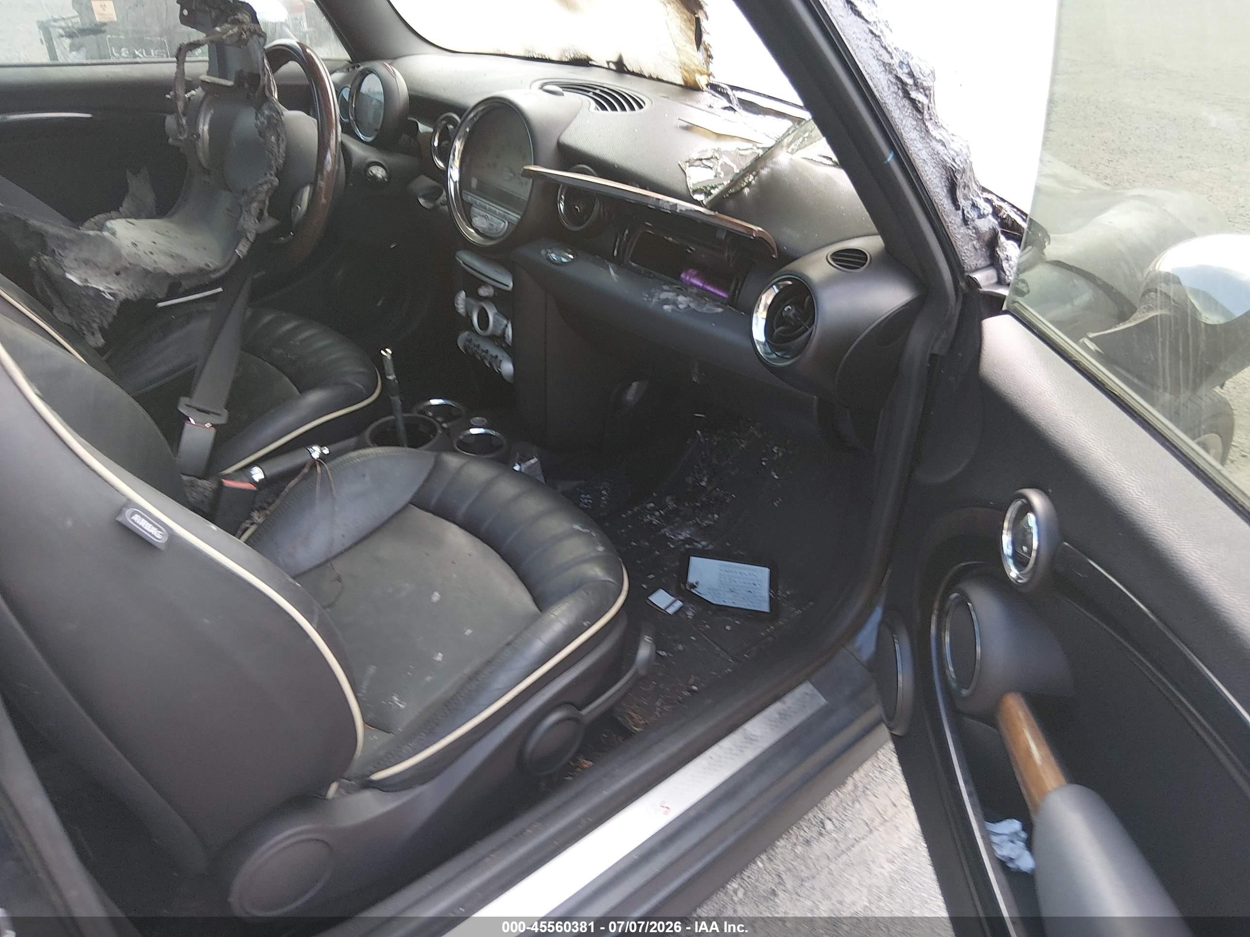 2009 Mini Cooper S   Black vin: WMWMF73509TT95015