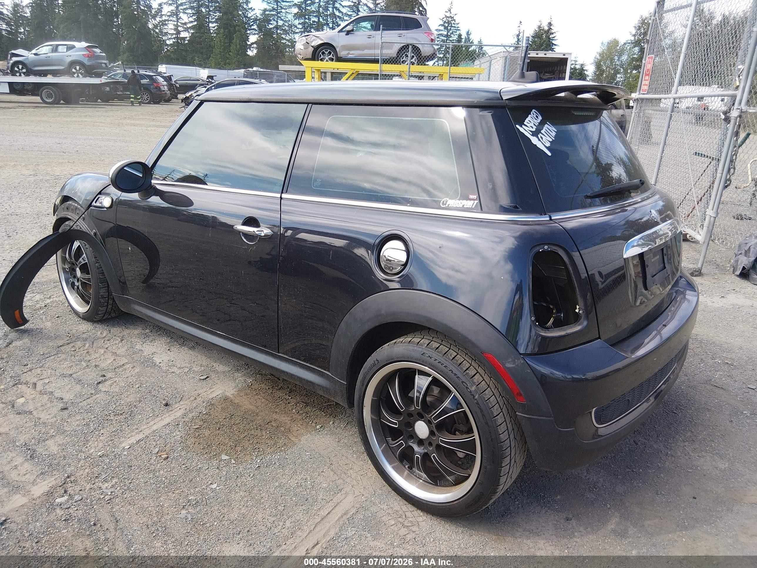2009 Mini Cooper S   Black vin: WMWMF73509TT95015