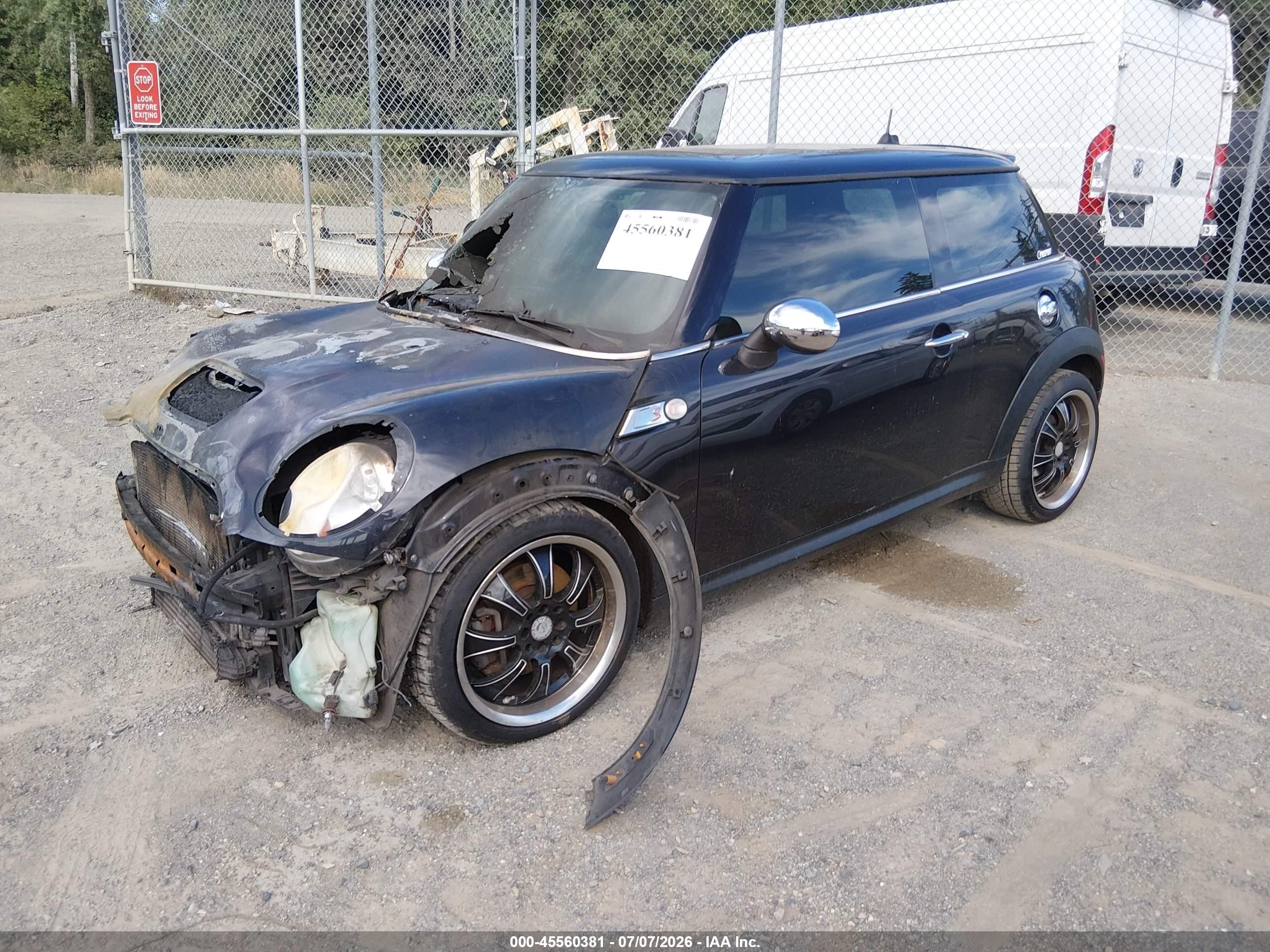 2009 Mini Cooper S   Black vin: WMWMF73509TT95015