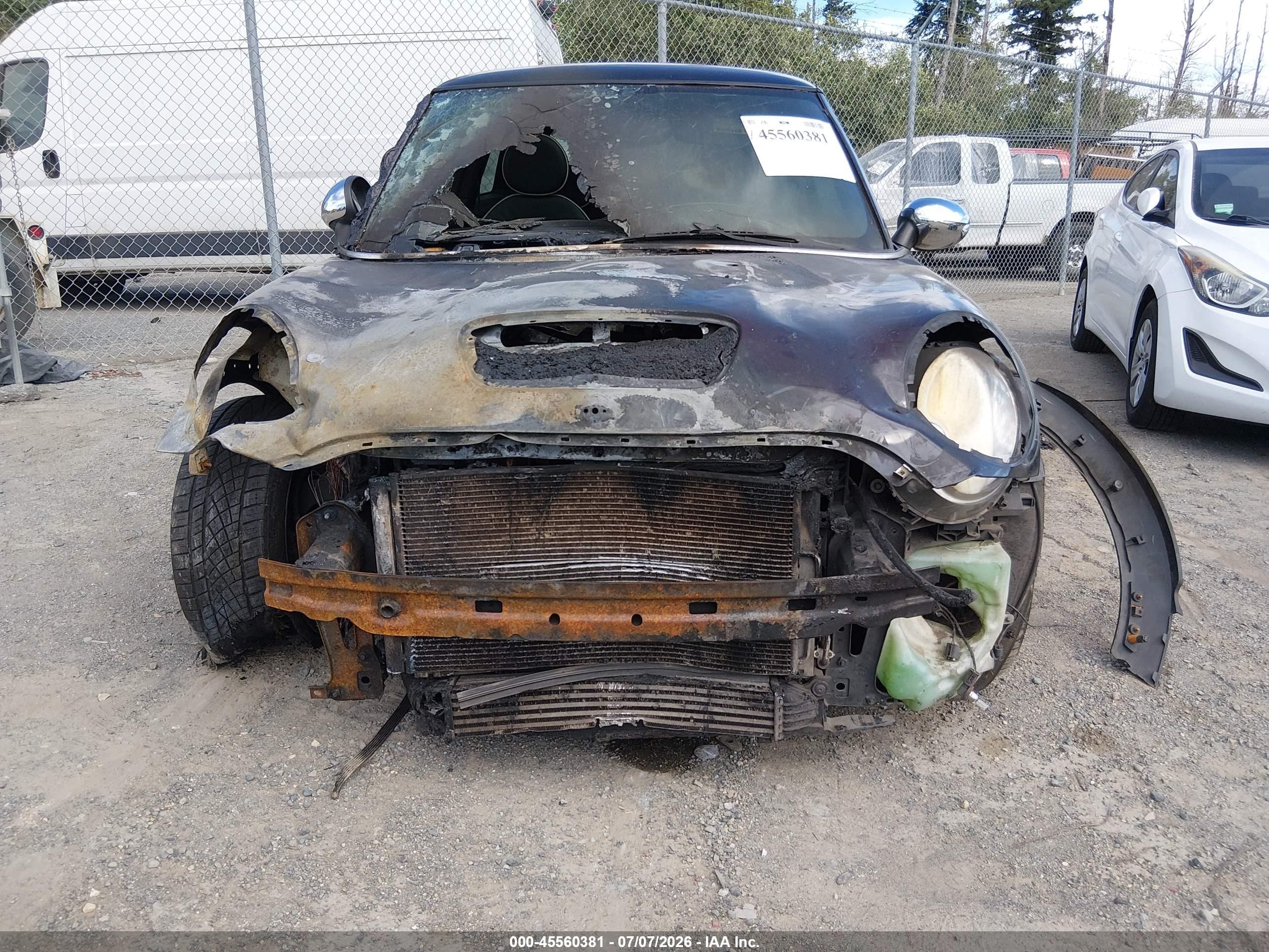 2009 Mini Cooper S   Black vin: WMWMF73509TT95015