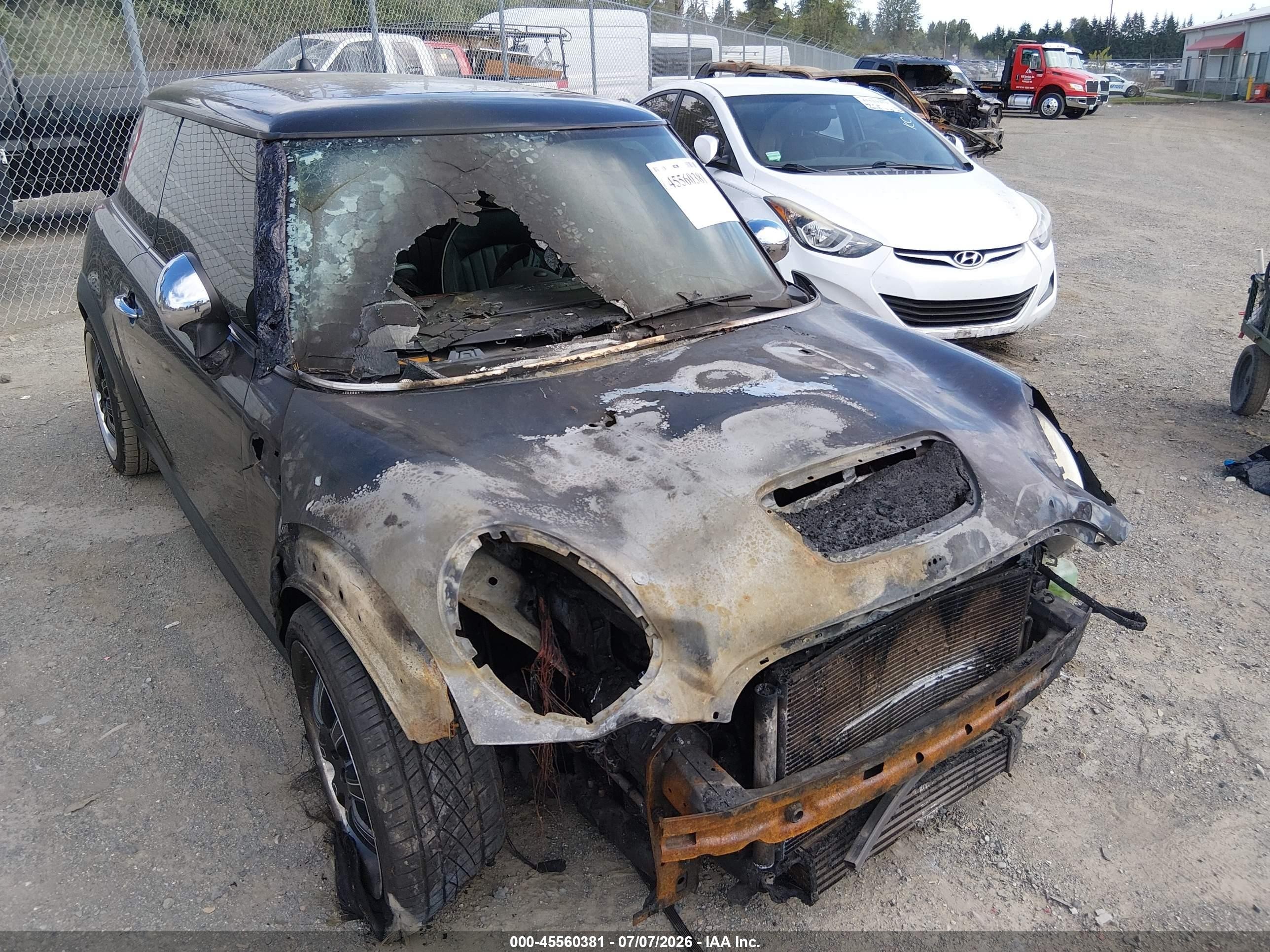 2009 Mini Cooper S   Black vin: WMWMF73509TT95015