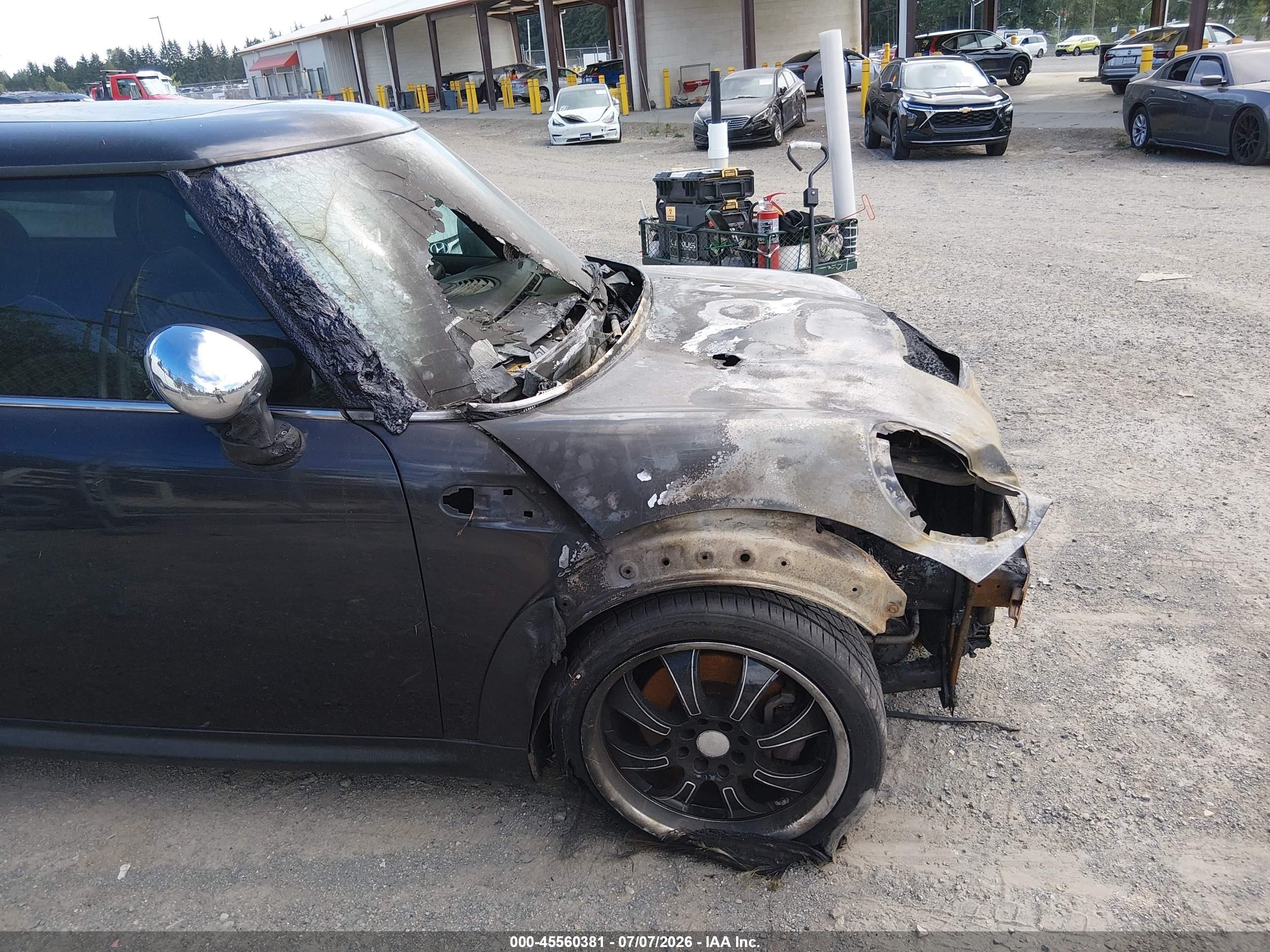 2009 Mini Cooper S   Black vin: WMWMF73509TT95015