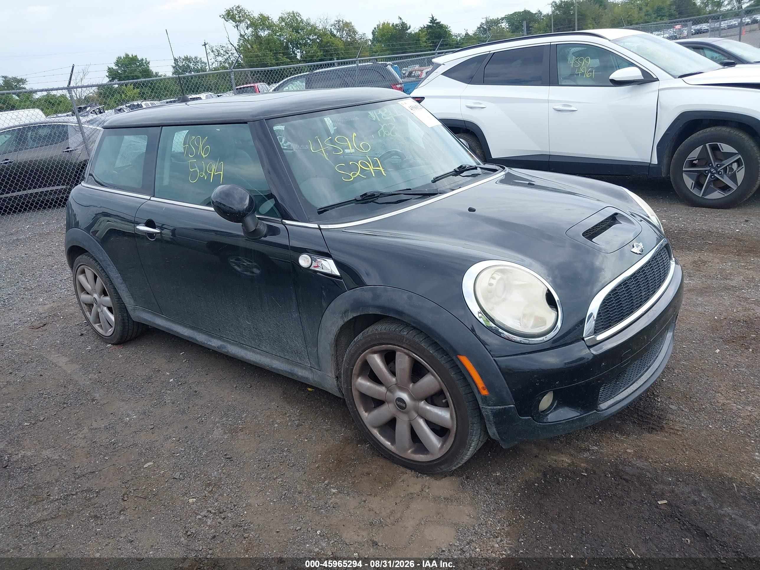 2009 Mini Cooper S   Black vin: WMWMF73539TT98409