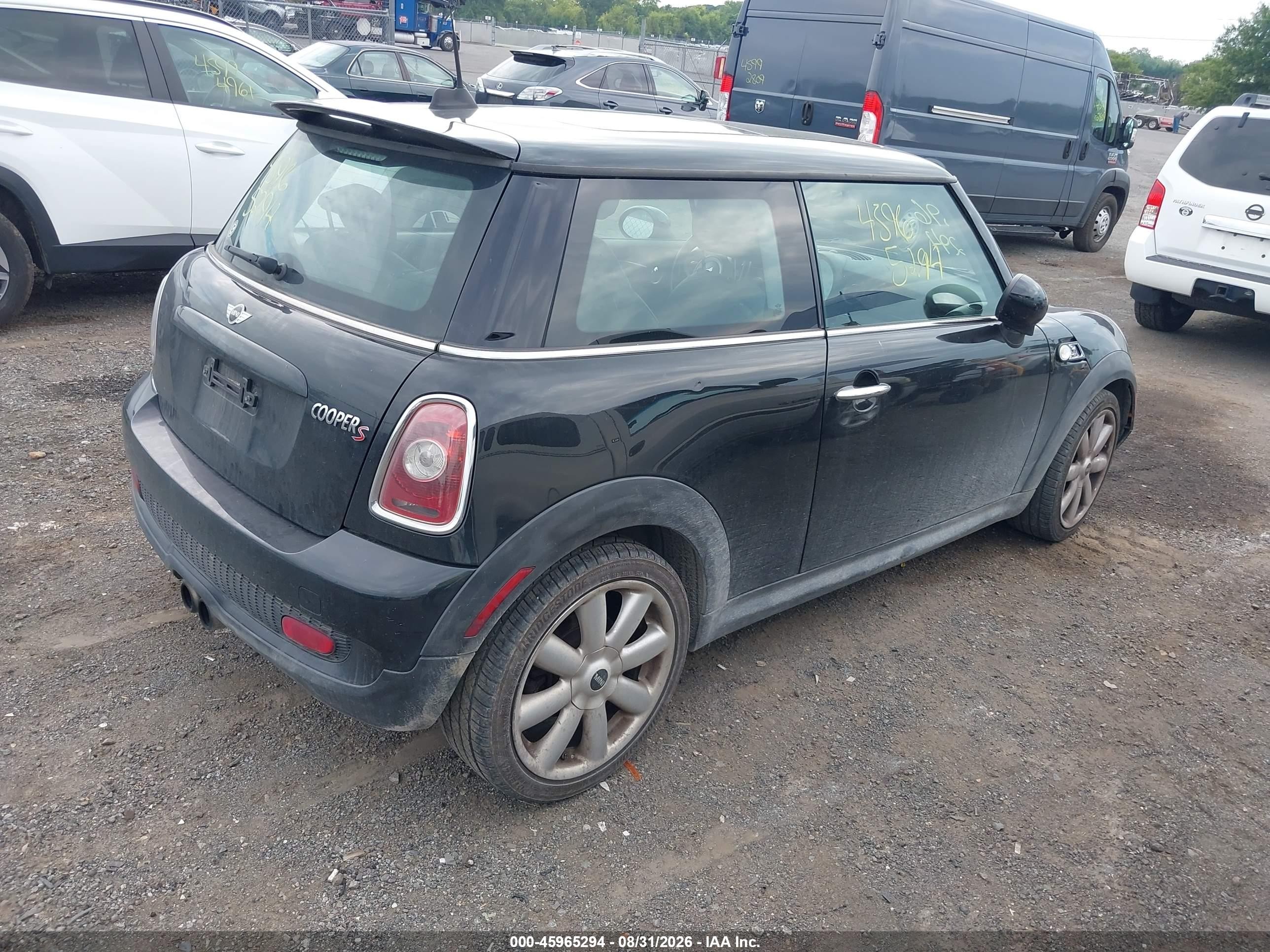 2009 Mini Cooper S   Black vin: WMWMF73539TT98409