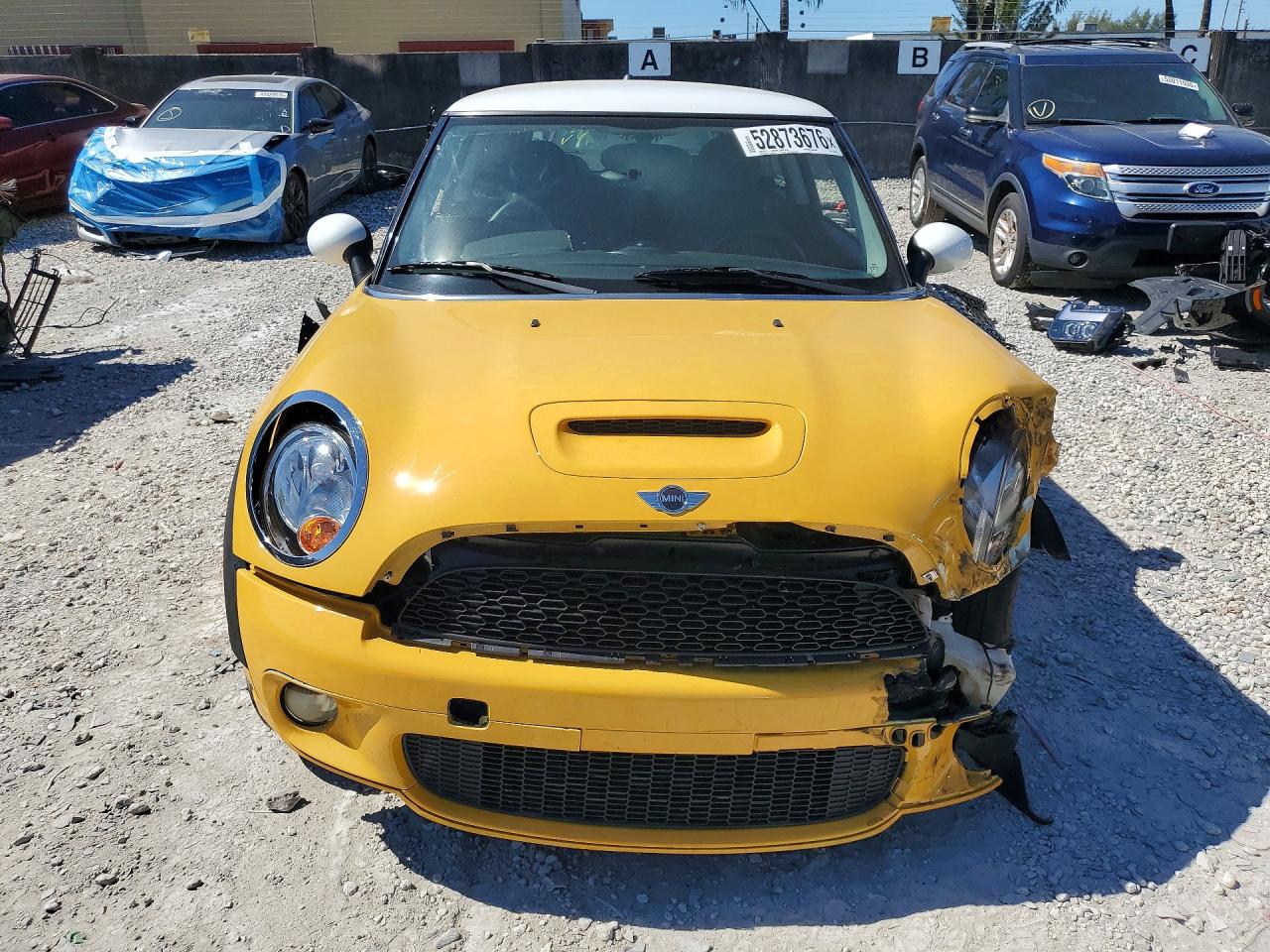 2009 Mini Cooper S Yellow vin: WMWMF73599TW82904
