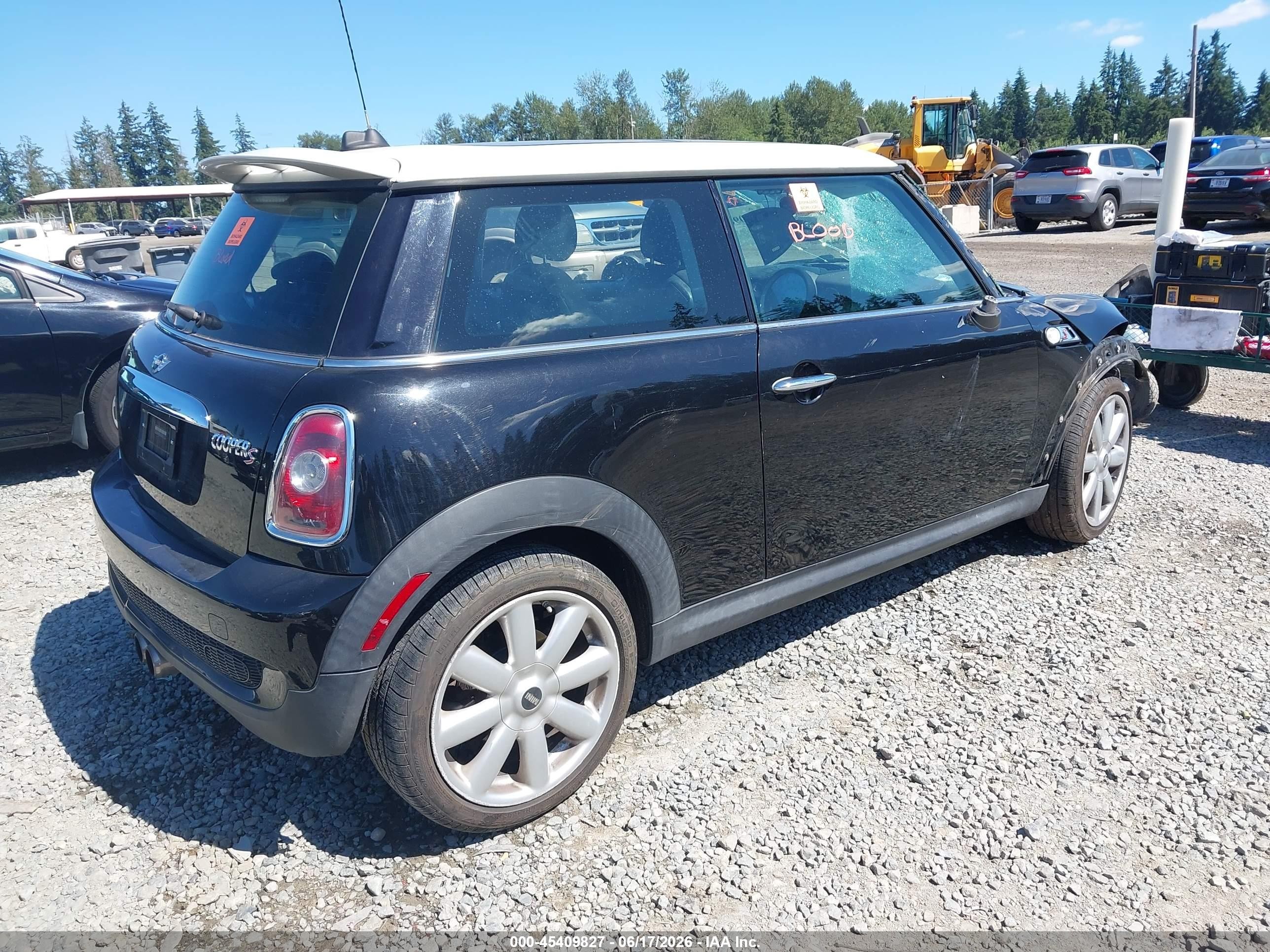 2009 Mini Cooper S   Black vin: WMWMF73599TW86077