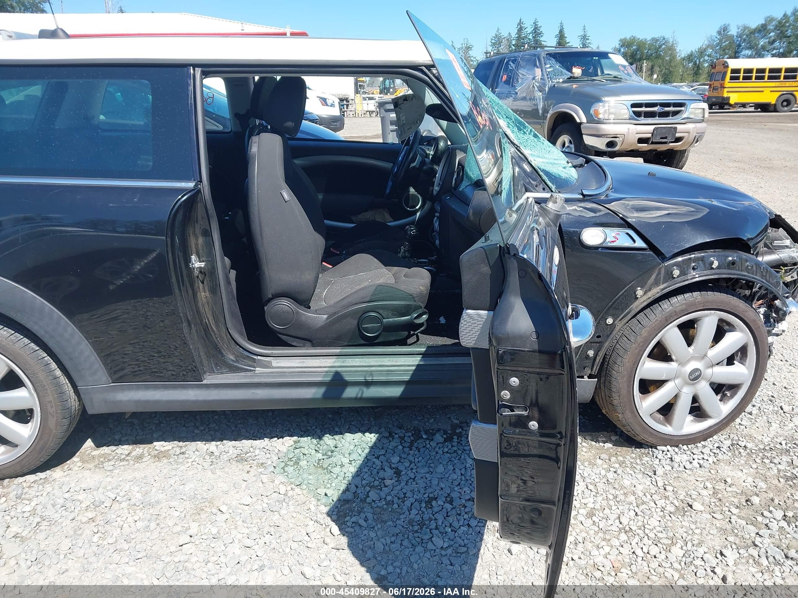 2009 Mini Cooper S   Black vin: WMWMF73599TW86077