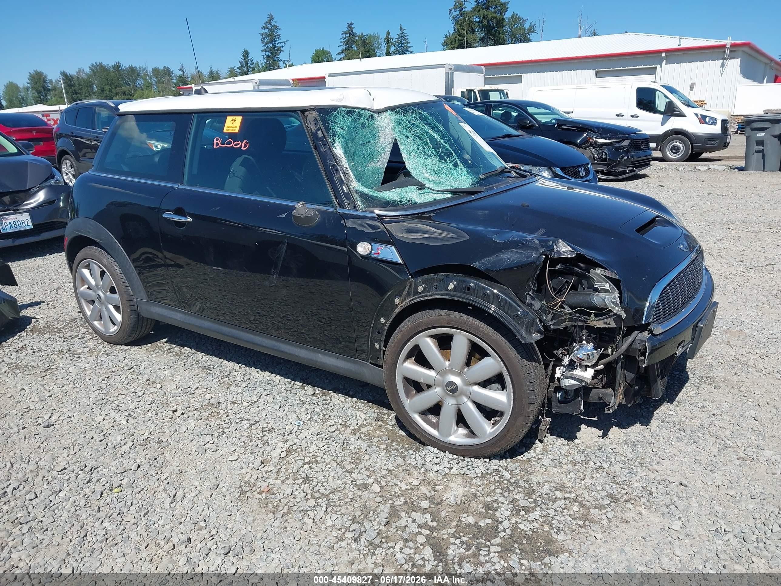 2009 Mini Cooper S   Black vin: WMWMF73599TW86077