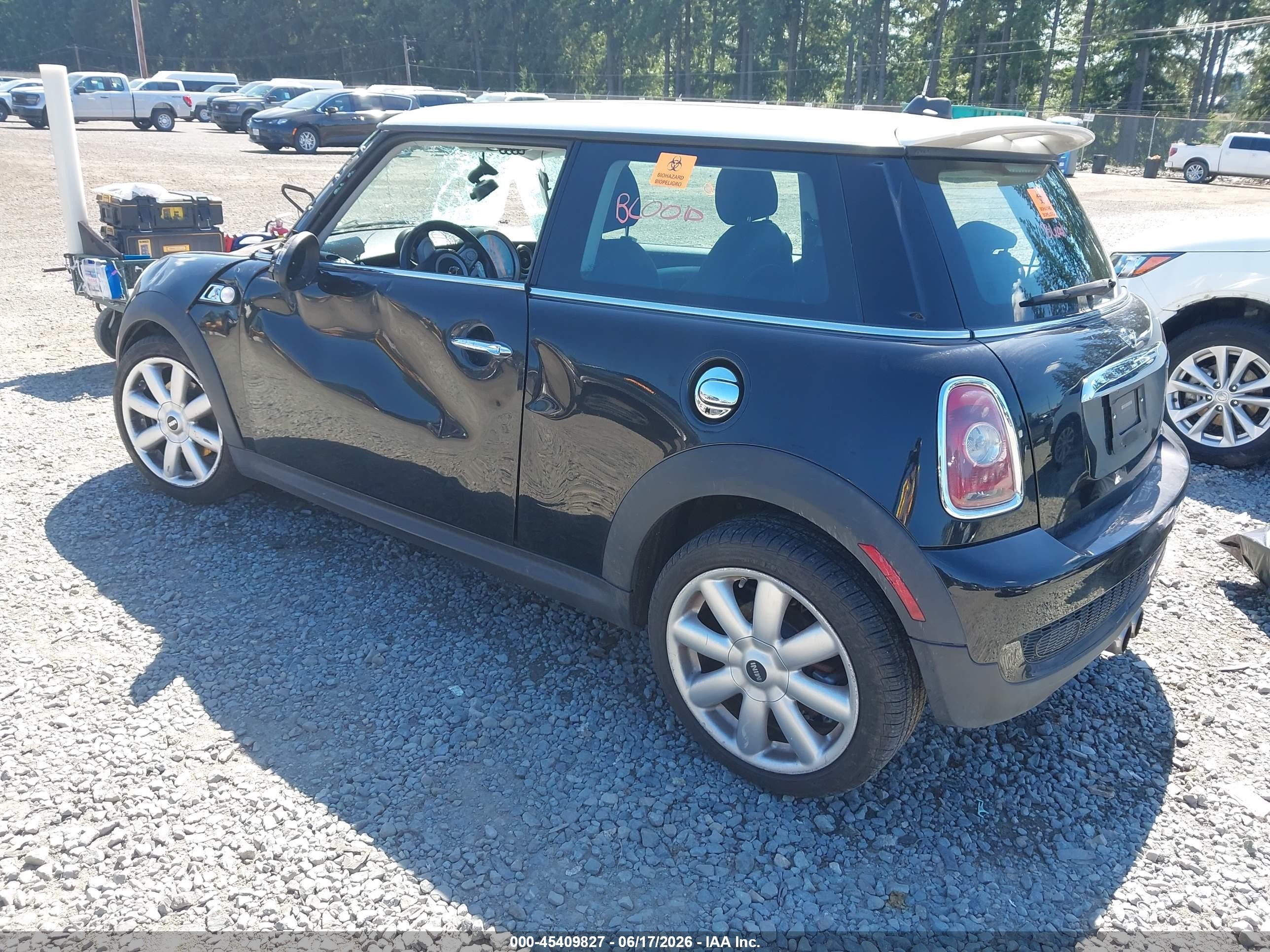 2009 Mini Cooper S   Black vin: WMWMF73599TW86077
