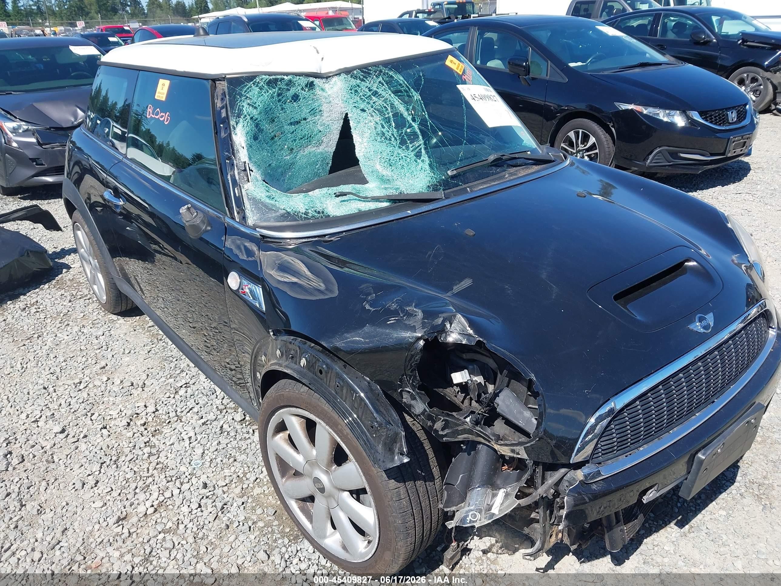 2009 Mini Cooper S   Black vin: WMWMF73599TW86077