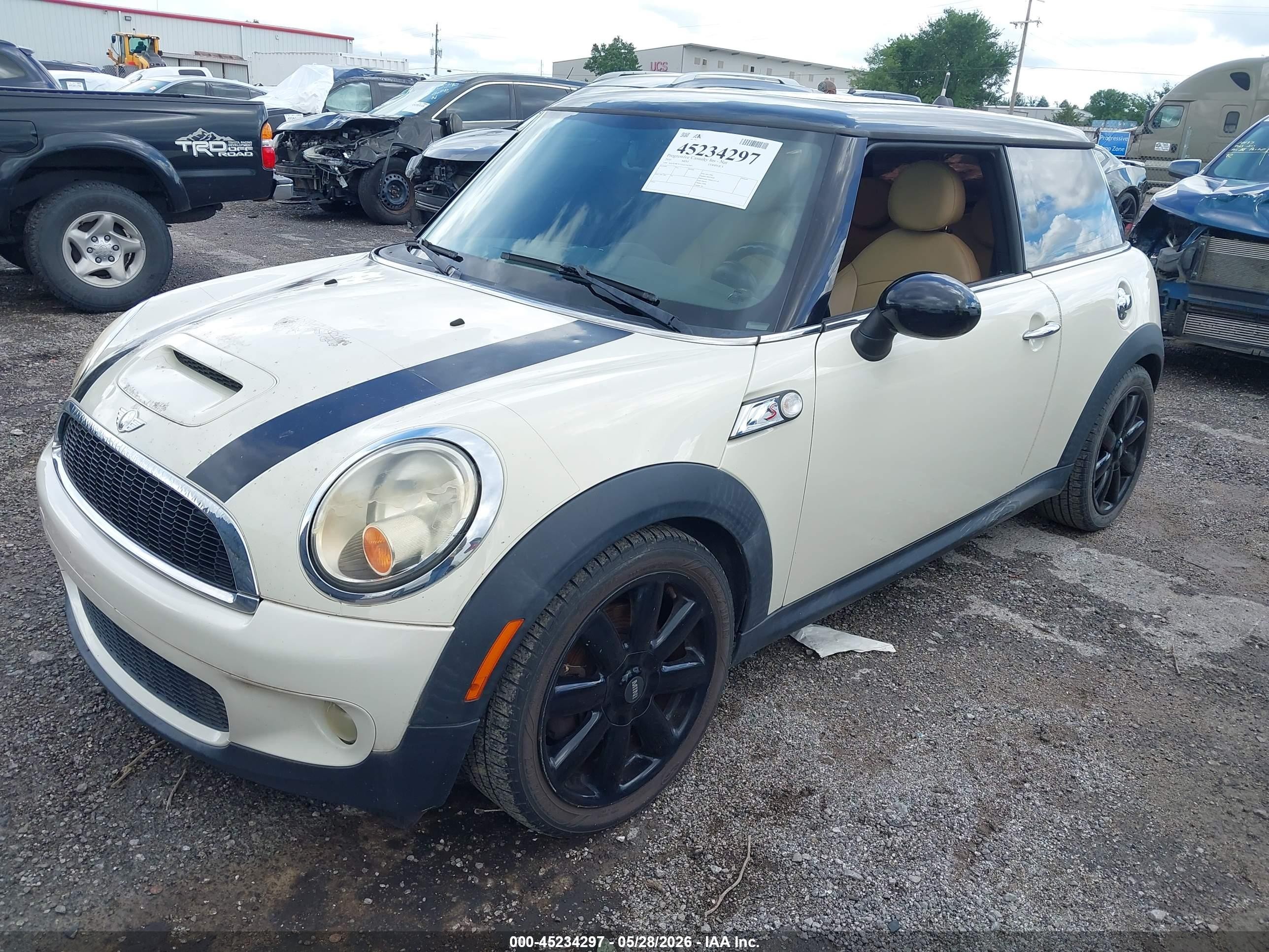 2010 Mini Cooper S   Cream vin: WMWMF7C53ATX42003