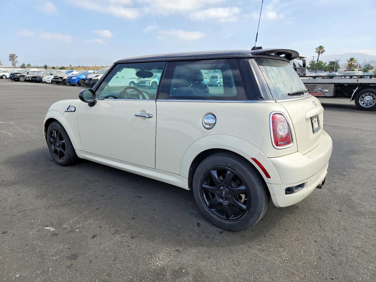 2010 Mini Cooper S Cream vin: WMWMF7C59ATZ70958