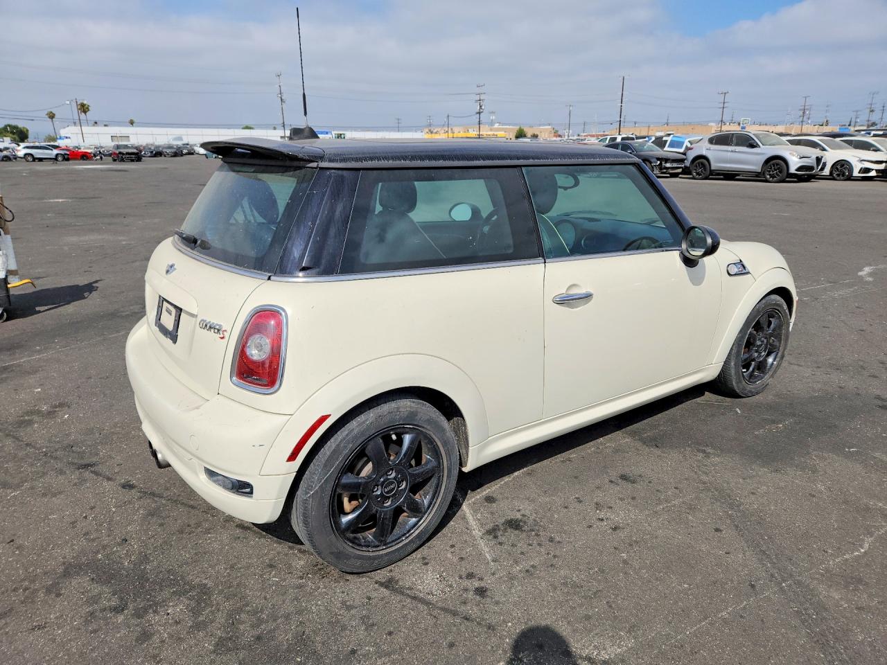 2010 Mini Cooper S Cream vin: WMWMF7C59ATZ70958