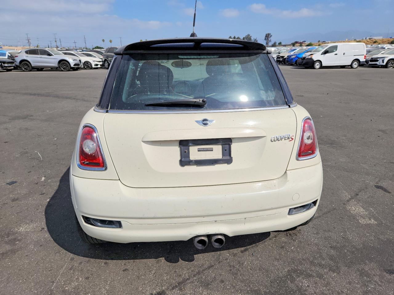 2010 Mini Cooper S Cream vin: WMWMF7C59ATZ70958