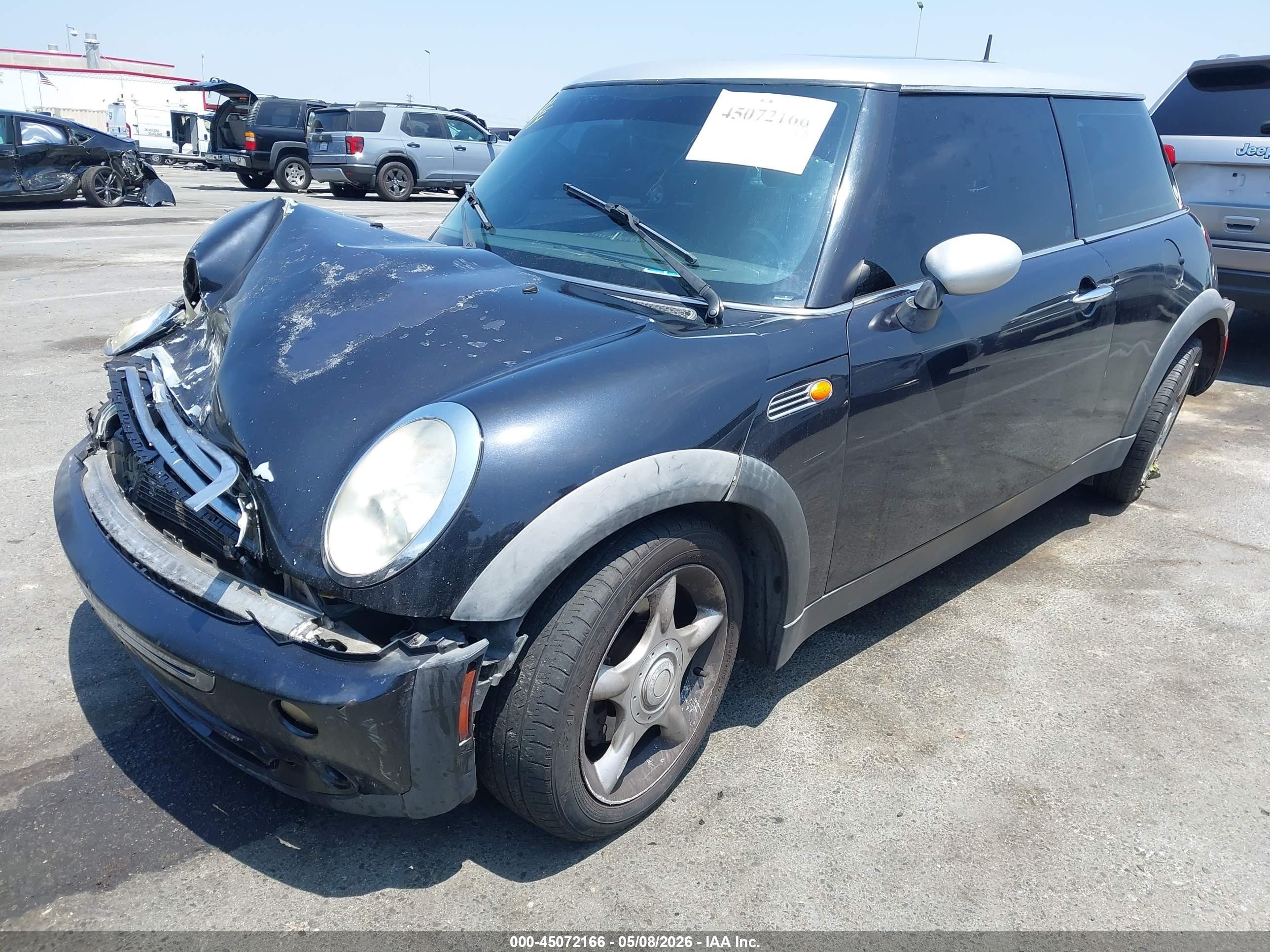 2006 Mini Cooper   Black vin: WMWRC33526TK17898