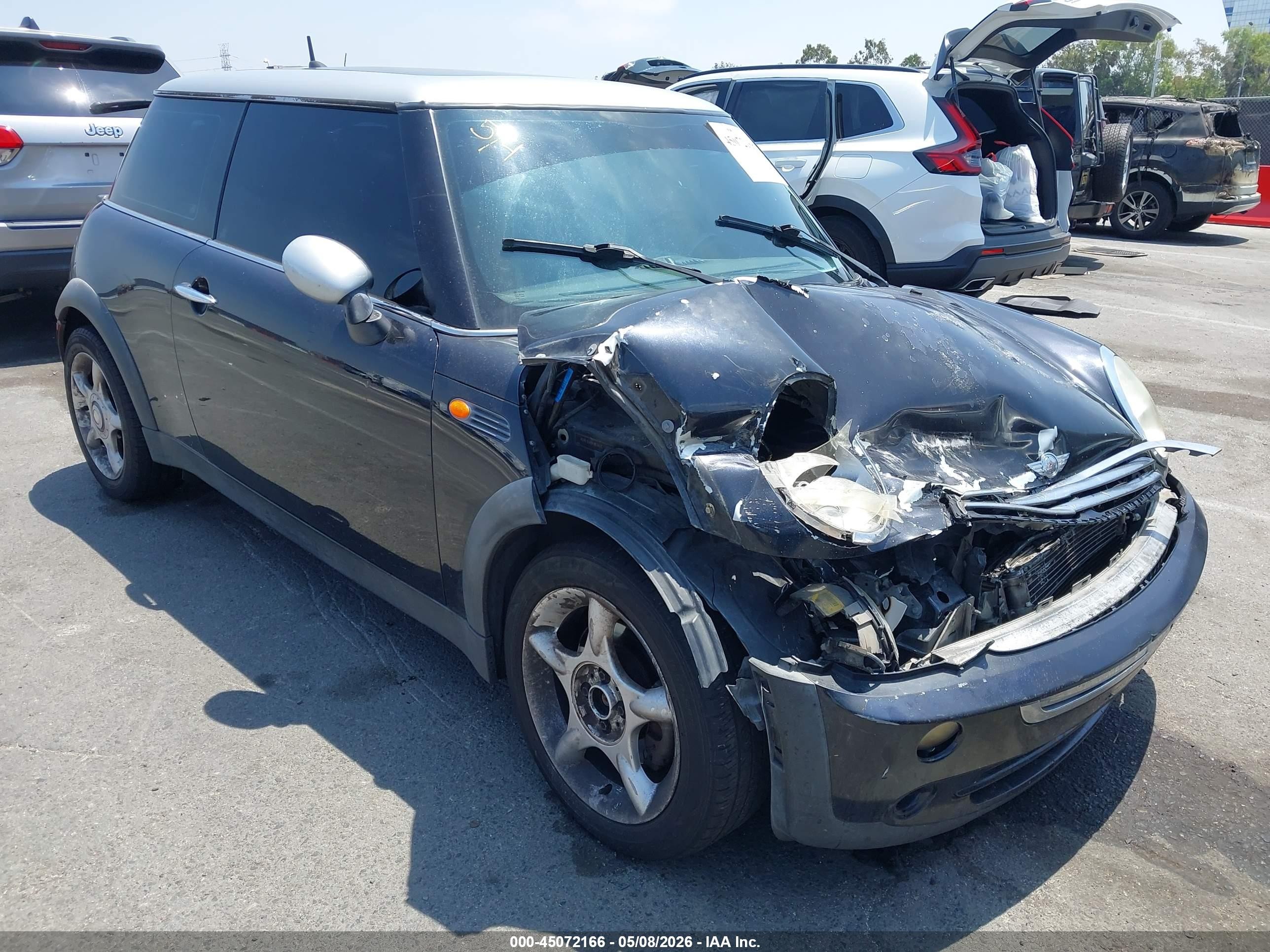 2006 Mini Cooper   Black vin: WMWRC33526TK17898