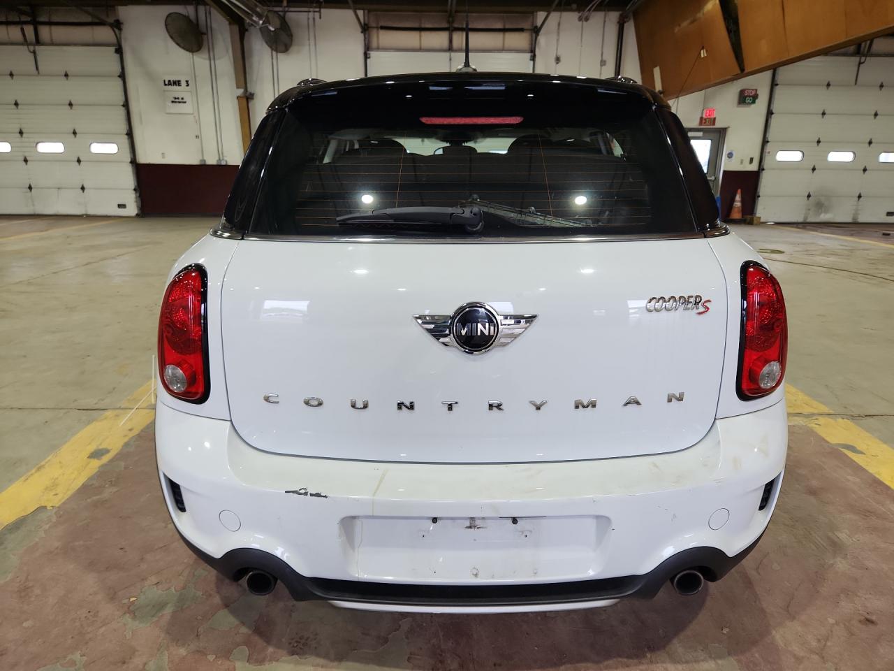 2015 Mini Cooper S Countryman White vin: WMWZC5C57FWP45642 Damage: Rear Bumper, Gouged, 3 To 4 Inches