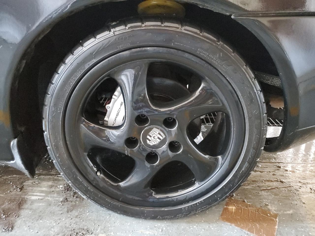 1999 Porsche Boxster Black vin: WP0CA2985XU629545 Damage: Left Rear Tire, Worn, Replacement Required