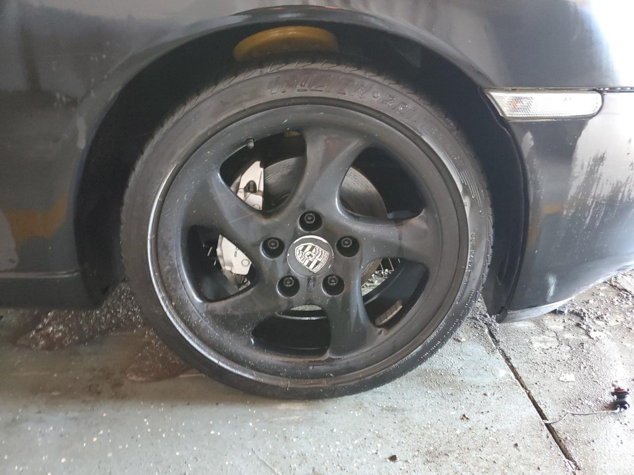 1999 Porsche Boxster Black vin: WP0CA2985XU629545 Damage: Right Front Tire, Worn, Replacement Required