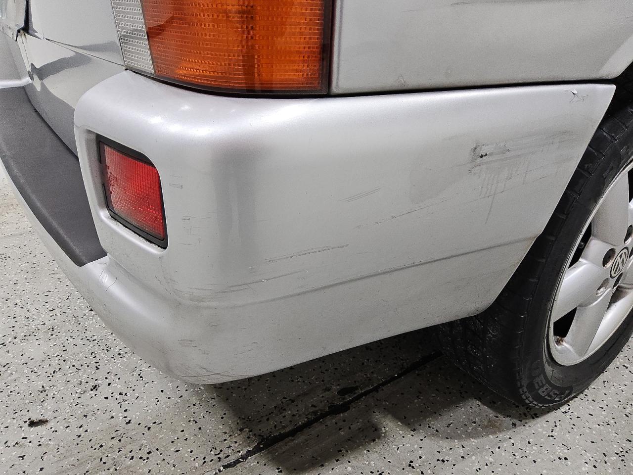 2002 Volkswagen Eurovan Mv Silver vin: WV2NB47012H017117 Damage: Rear Bumper, Heavy Scratch, > 12 Inches