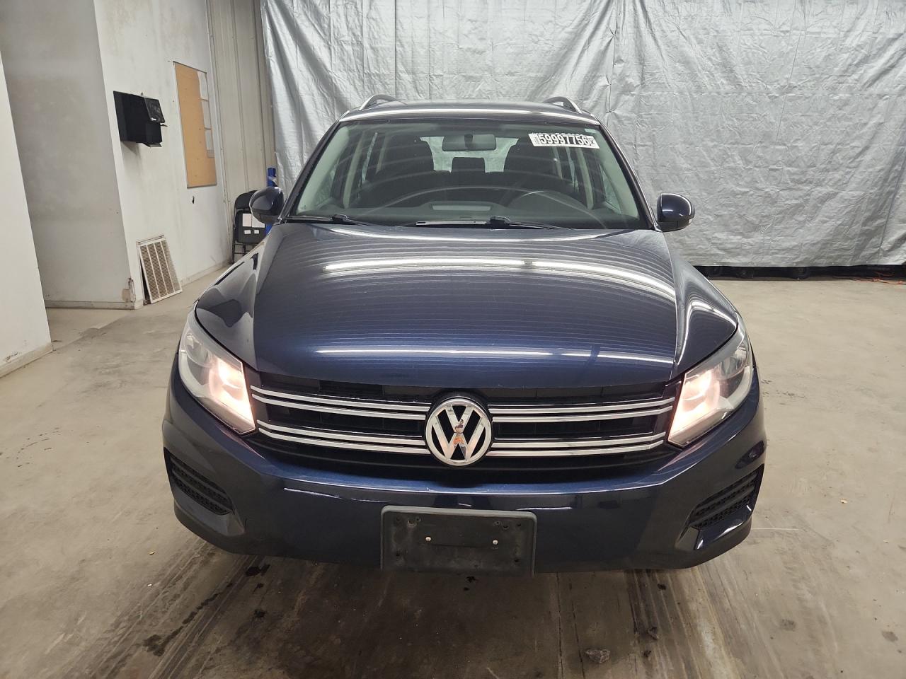 2015 Volkswagen Tiguan S Blue vin: WVGAV7AX0FW595475 Damage: Left Head Lamp, Faded, Repair Required