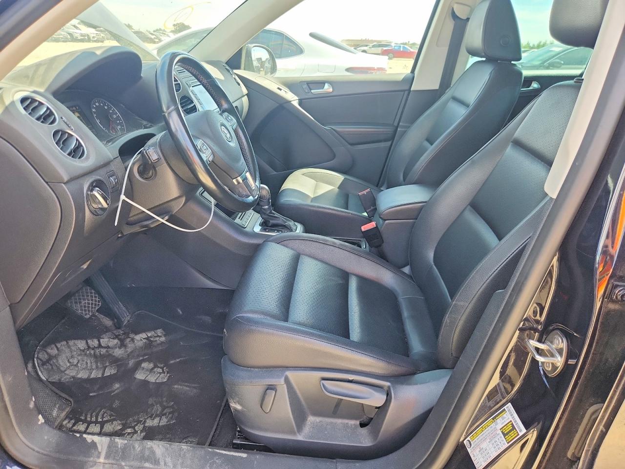 2012 Volkswagen Tiguan Черный vin: WVGBV7AX4CW518544