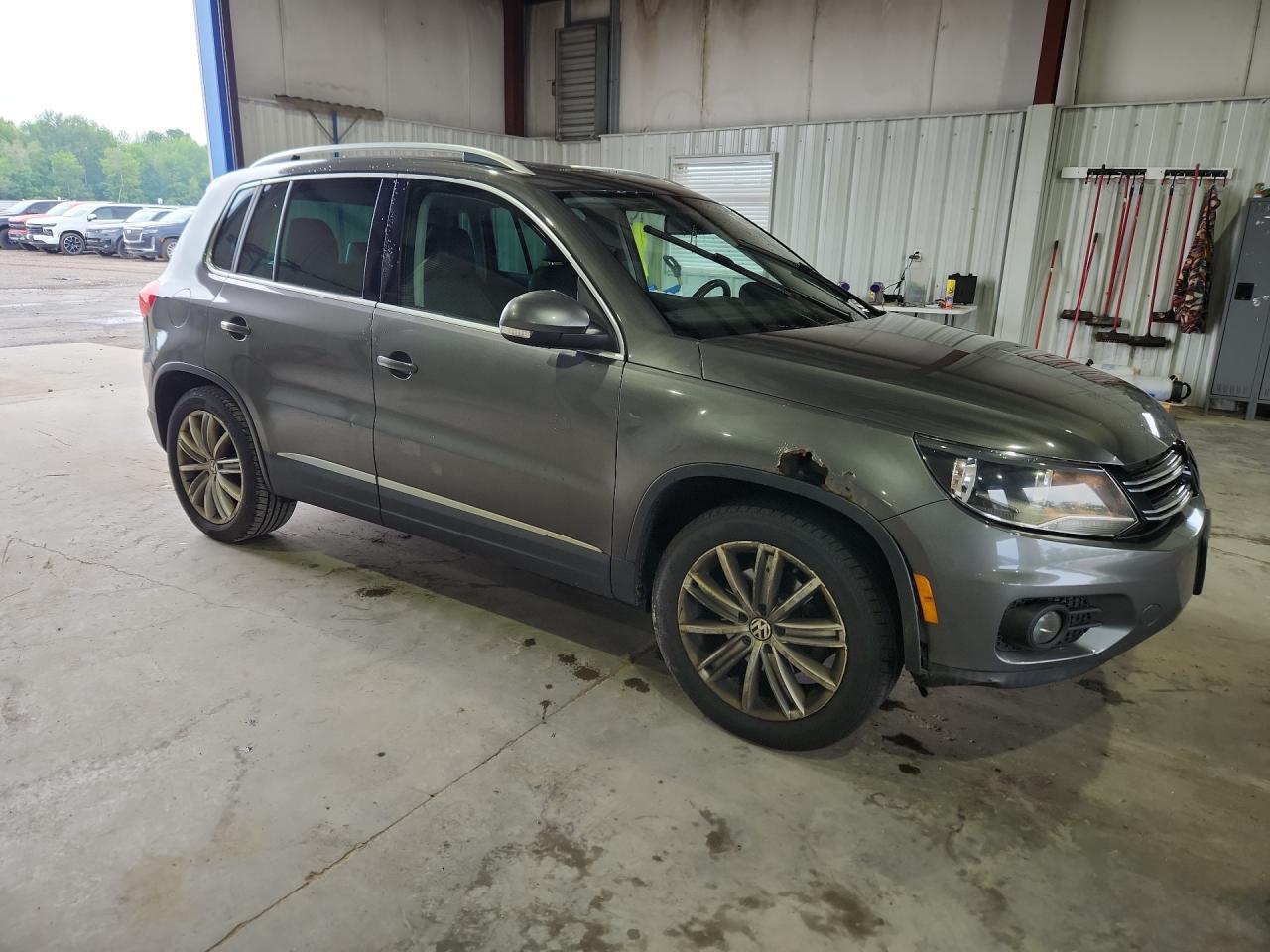 2012 Volkswagen Tiguan S Gray vin: WVGBV7AX7CW081879 Damage: Right Rear Door, Dent(S) W/ Paint Dmg, 1 To 2 Inches