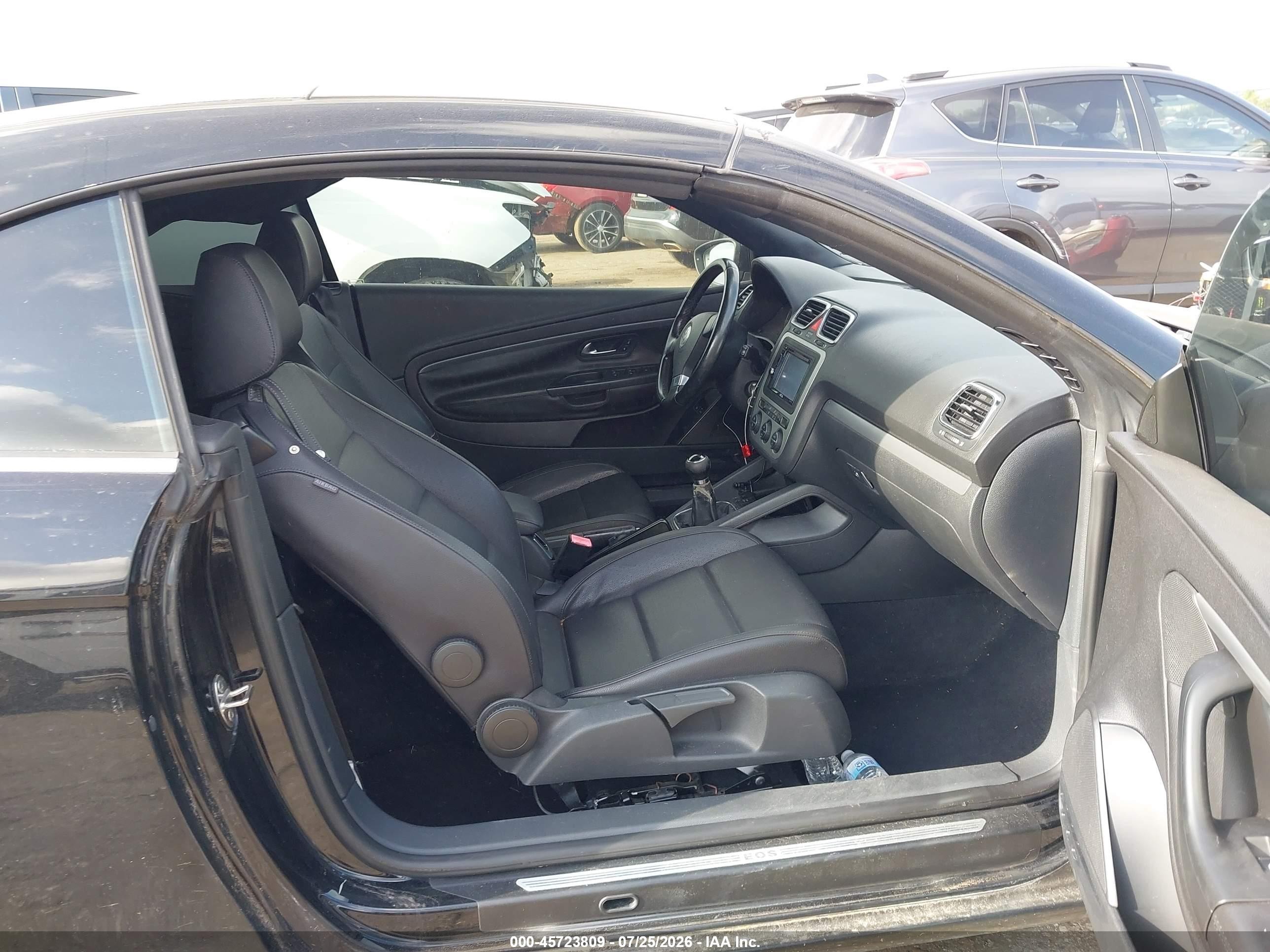 2009 Volkswagen Eos Komfort Черный vin: WVWAA71F79V021103