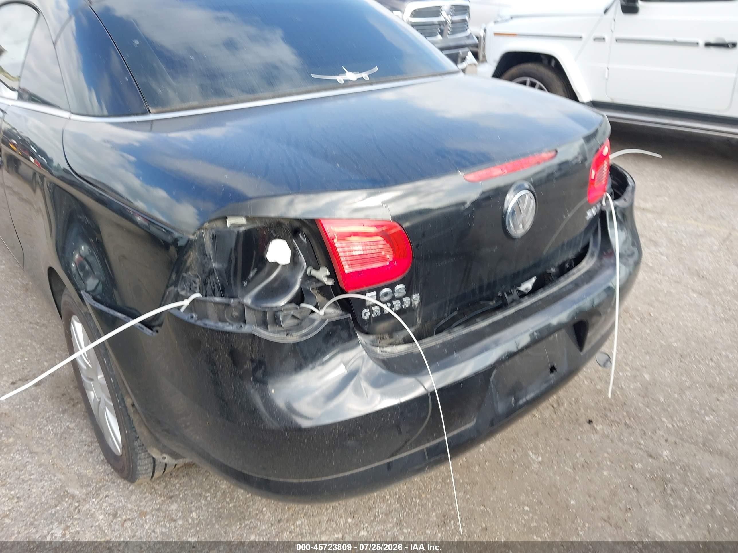 2009 Volkswagen Eos Komfort Черный vin: WVWAA71F79V021103