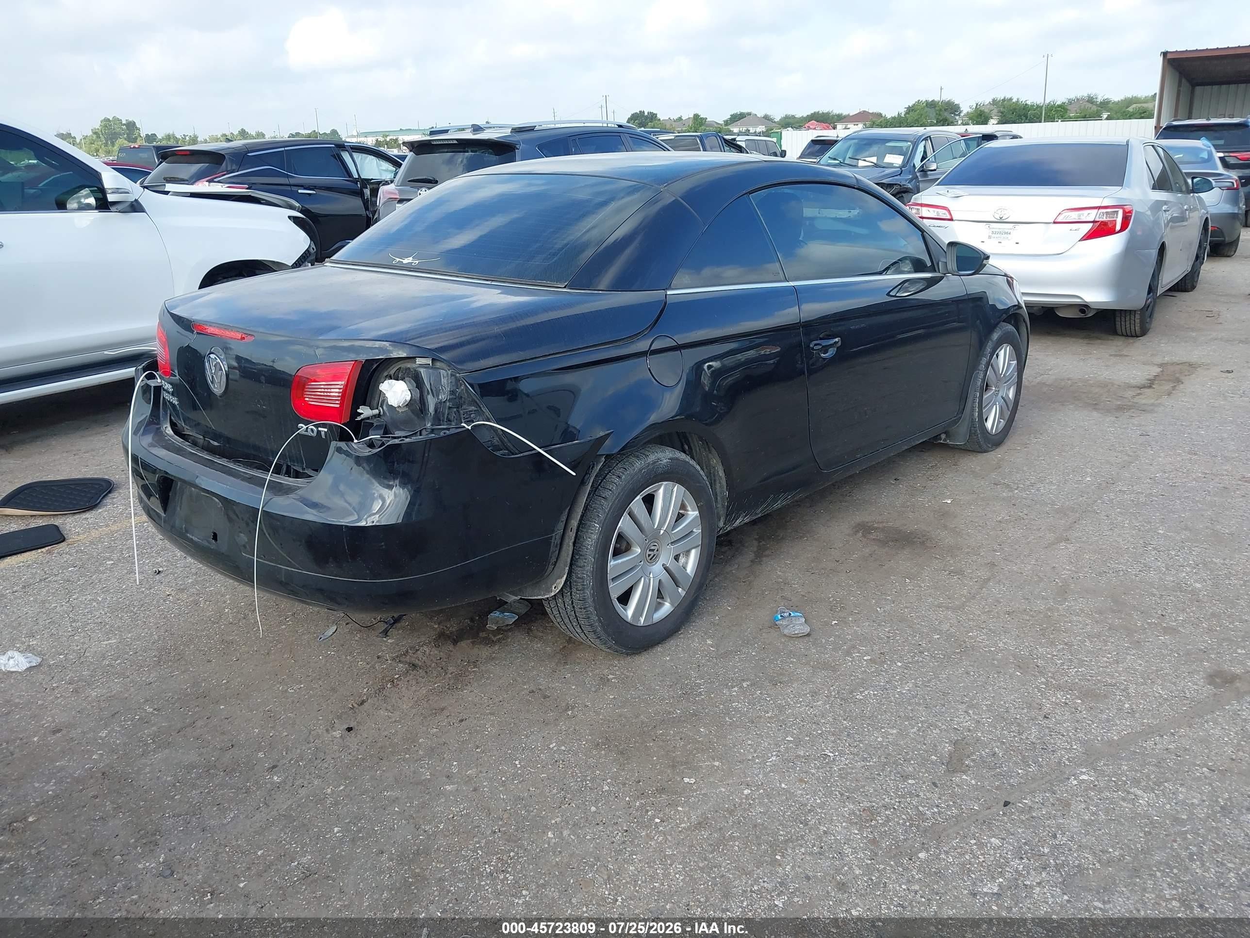 2009 Volkswagen Eos Komfort Черный vin: WVWAA71F79V021103