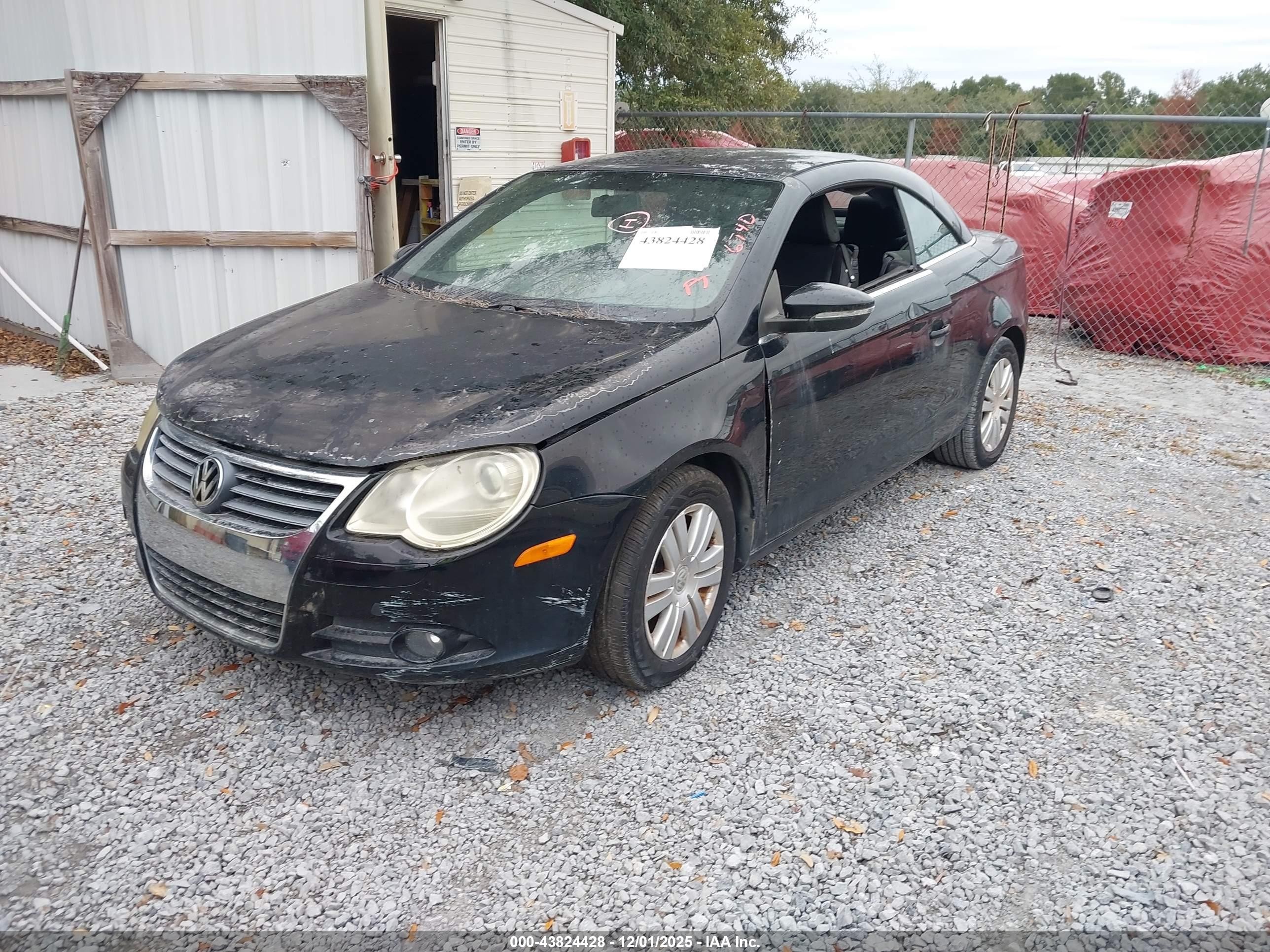 2010 Volkswagen Eos Komfort Black vin: WVWAA7AH1AV011561