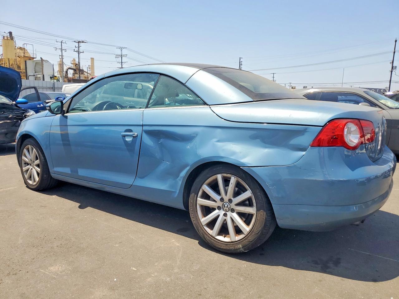 2009 Volkswagen Eos Turbo Blue vin: WVWBA71F39V006019