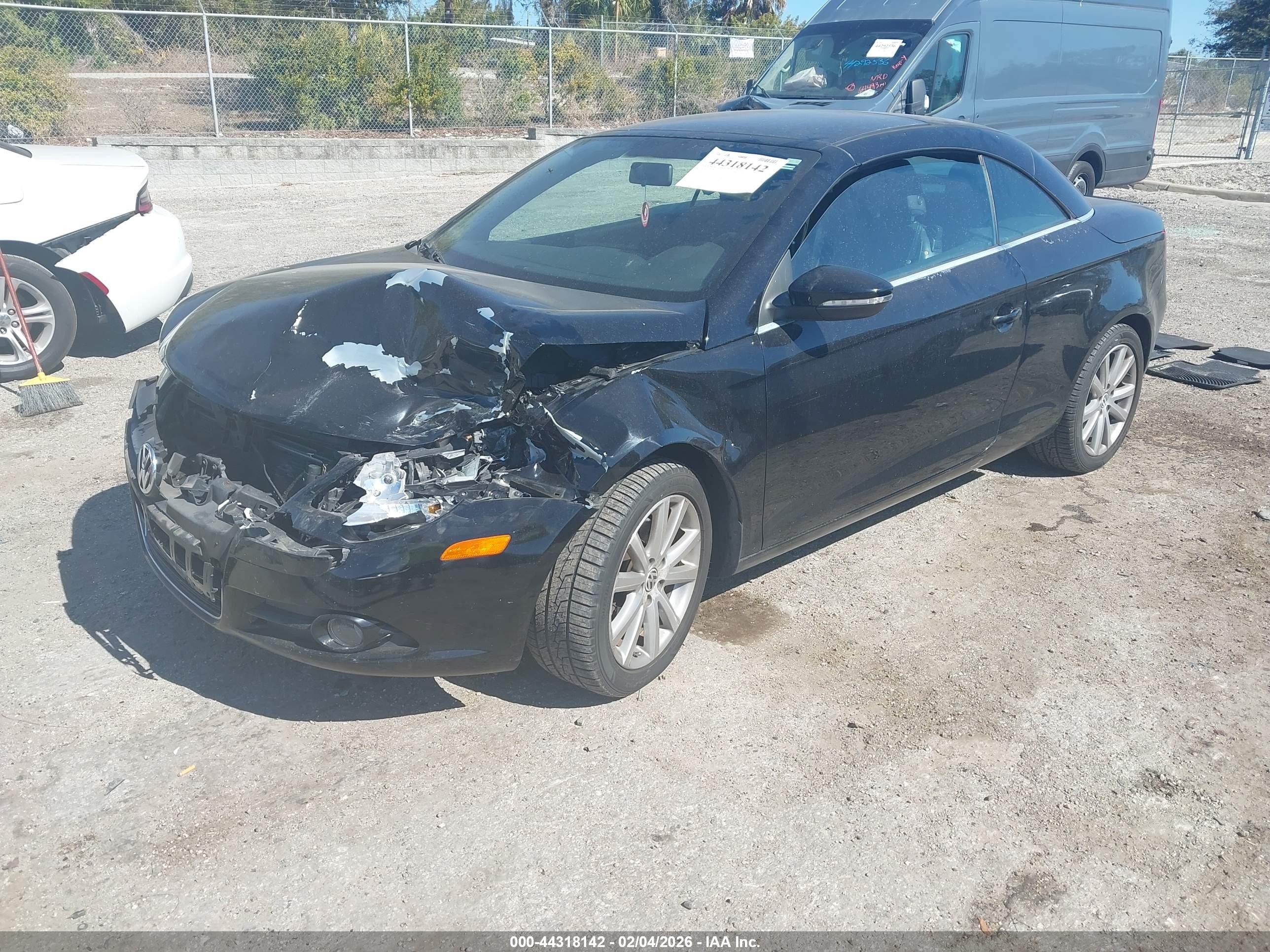 2009 Volkswagen Eos Komfort Черный vin: WVWBA71F89V013354