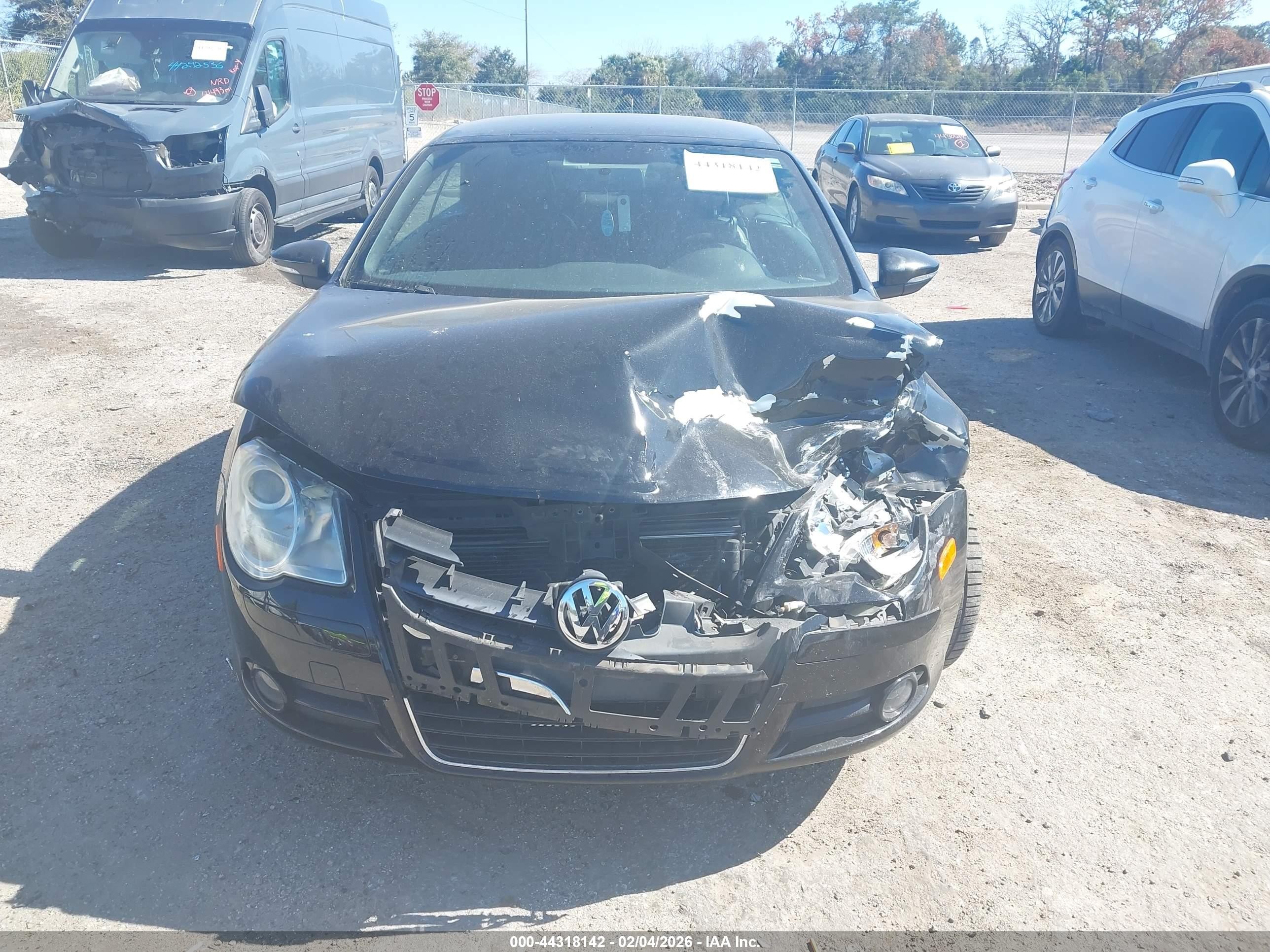 2009 Volkswagen Eos Komfort Черный vin: WVWBA71F89V013354