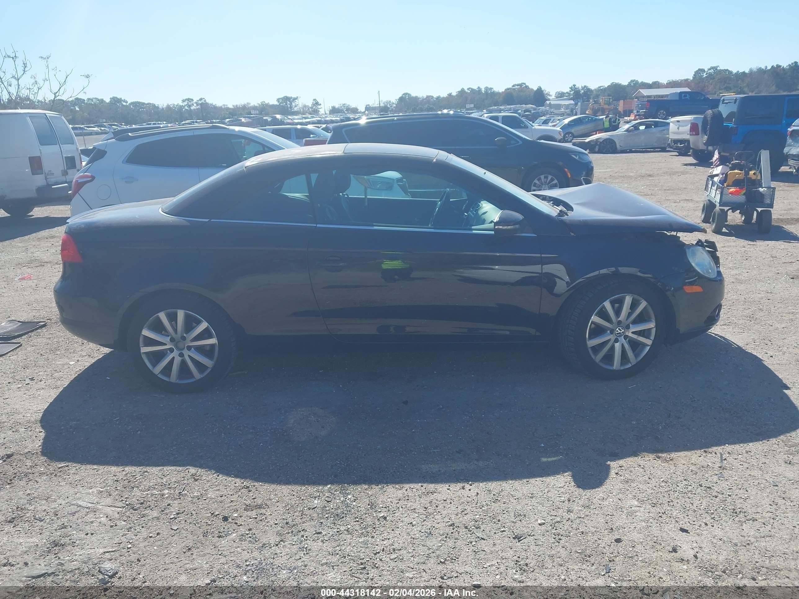 2009 Volkswagen Eos Komfort Черный vin: WVWBA71F89V013354