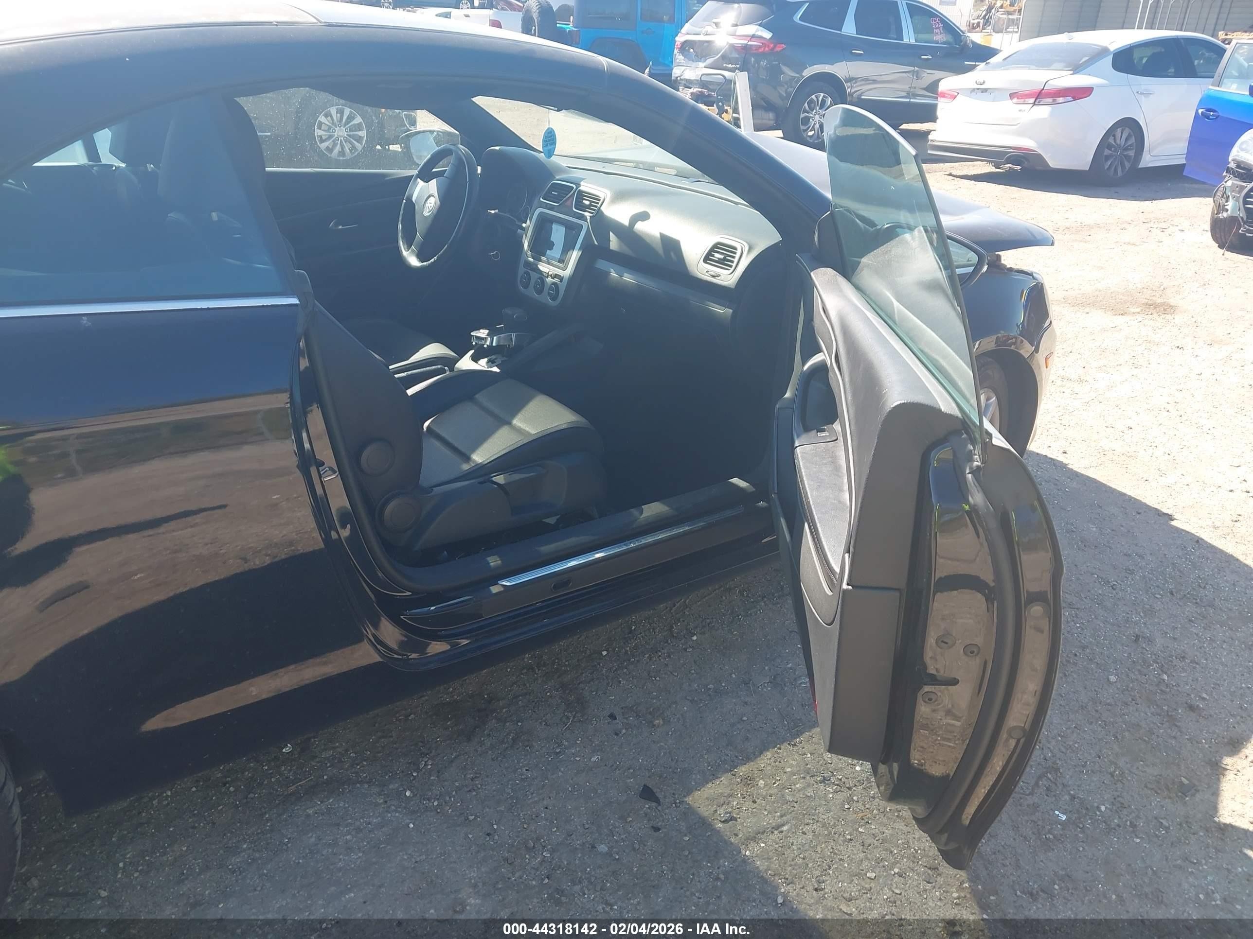 2009 Volkswagen Eos Komfort Черный vin: WVWBA71F89V013354