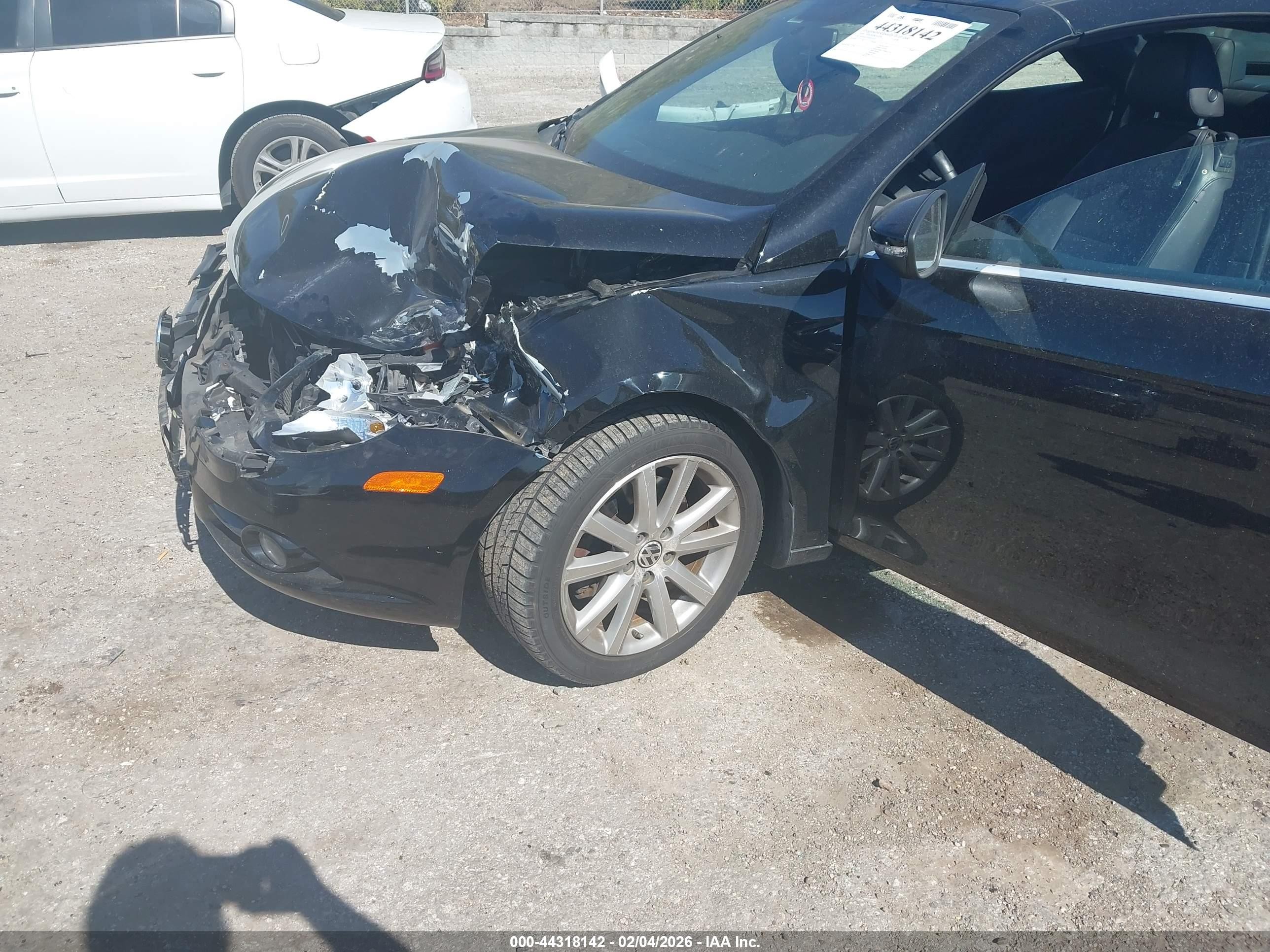 2009 Volkswagen Eos Komfort Черный vin: WVWBA71F89V013354