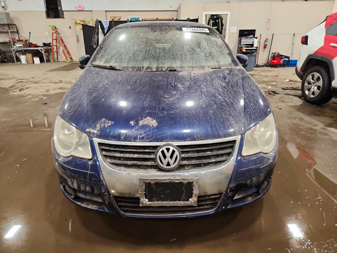 2009 Volkswagen Eos Lux Blue vin: WVWFA71F69V024483