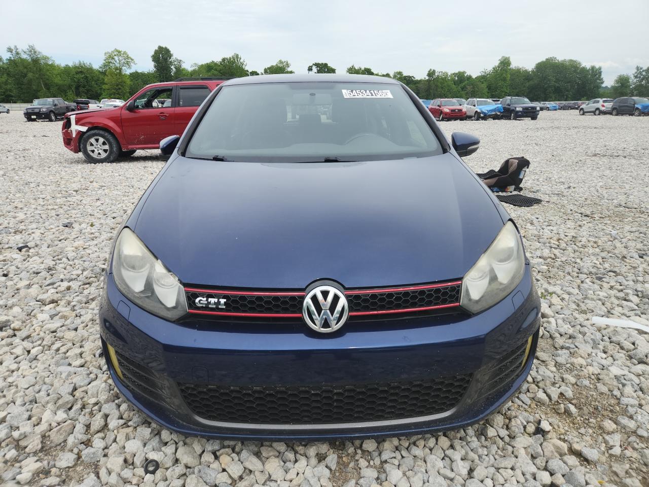 2011 Volkswagen Gti Blue vin: WVWHV7AJ4BW039632 Damage: Left Head Lamp, Faded, Repair Required