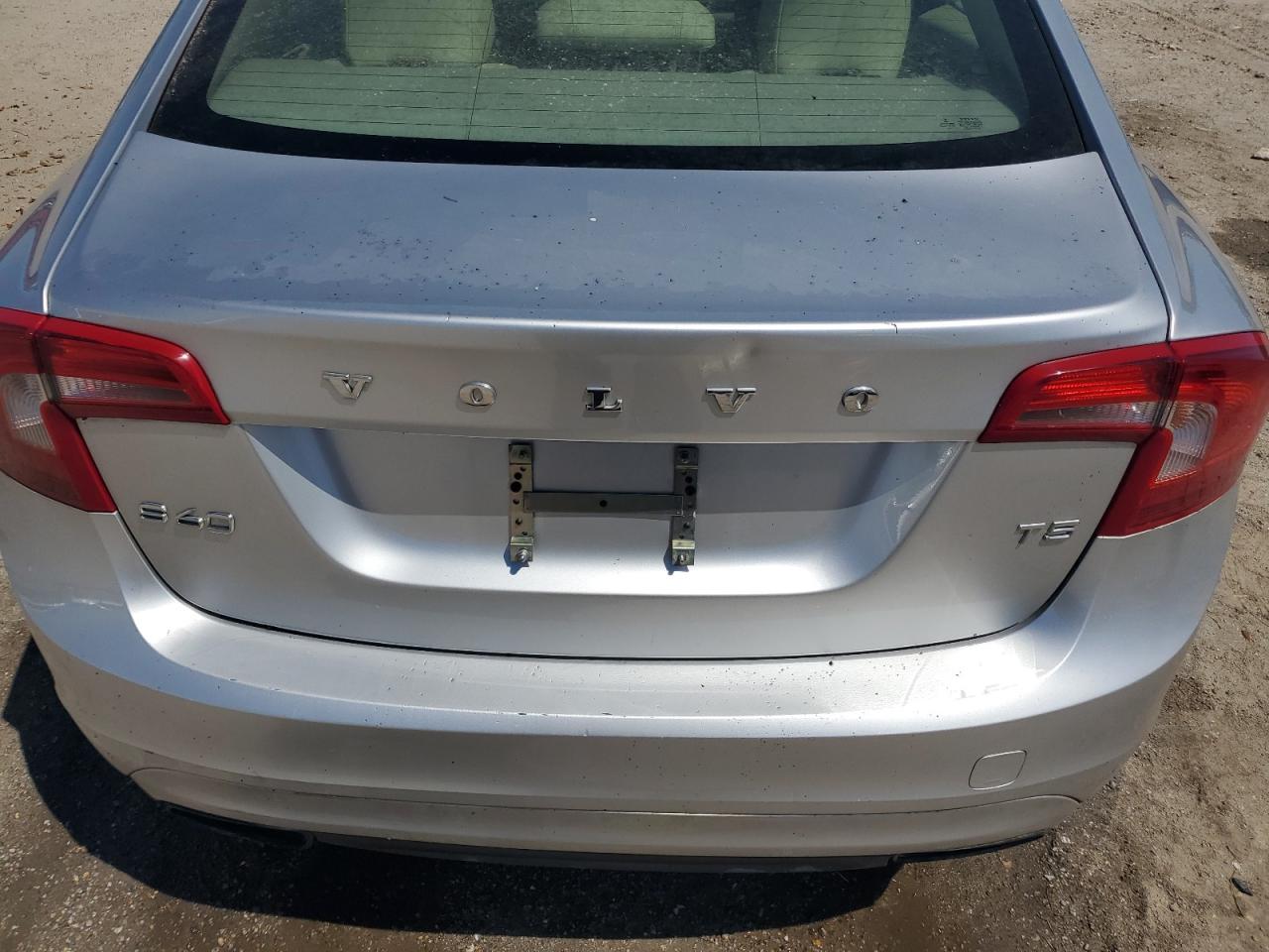 2014 Volvo S60 T5 Silver vin: YV1612FS2E1289955 Damage: Deck Lid, Dent(S) W/ Paint Dmg, 2 To 3 Inches